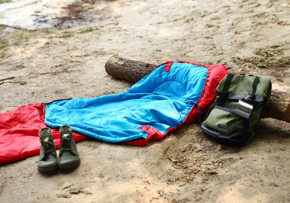 sleeping bag with backpack and shoes