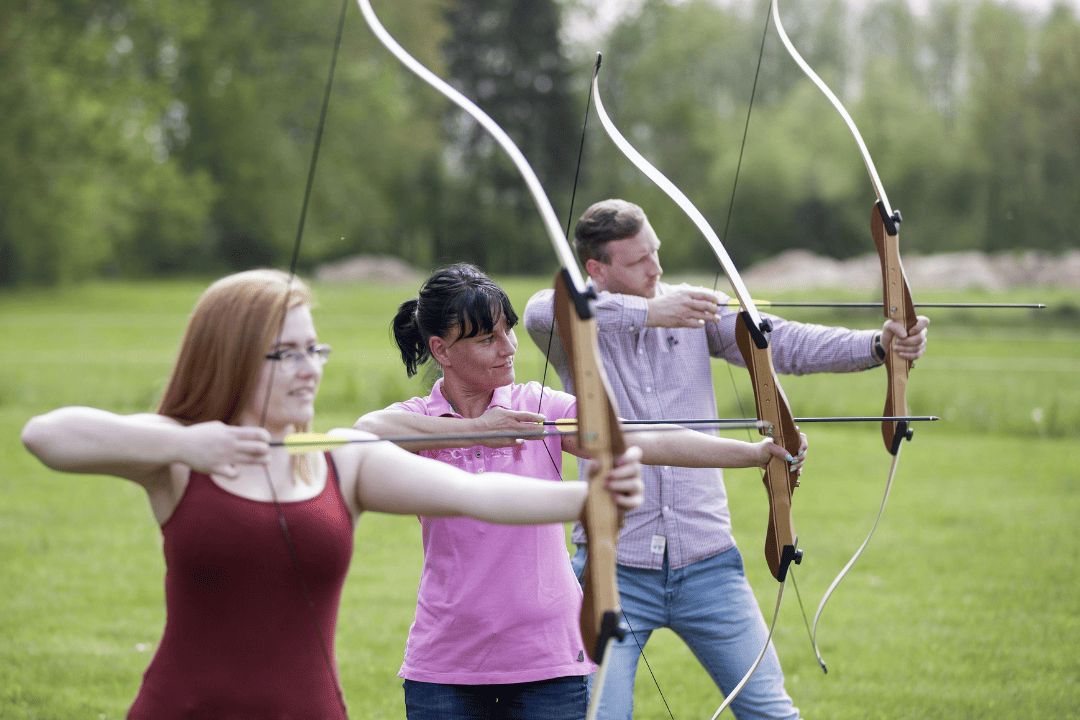 people doing archery