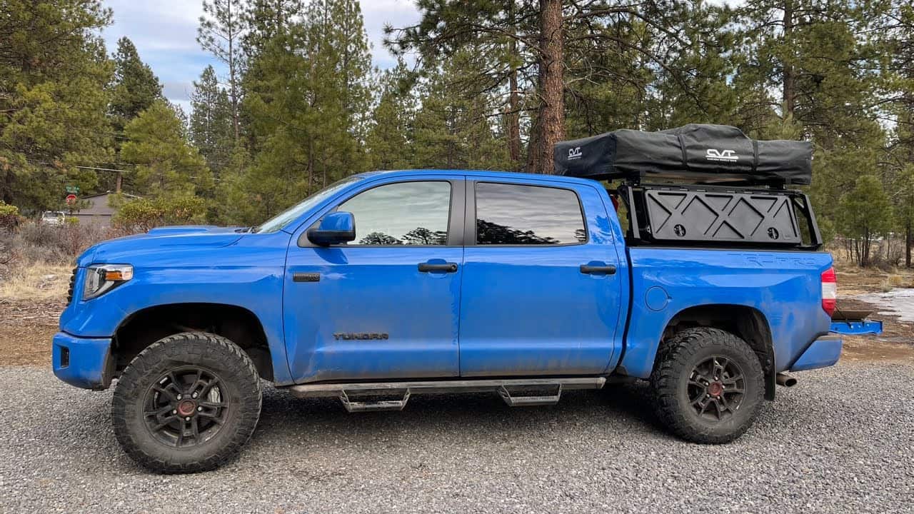 Blue Toyota Tundra with Roof Top Tent