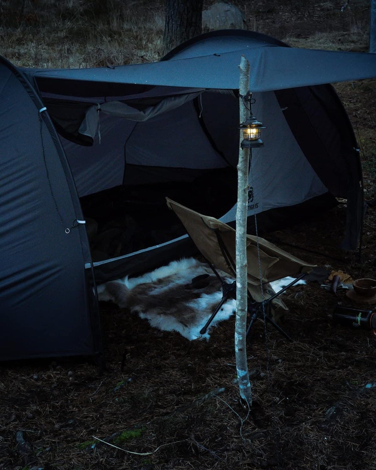 Using a stick to hold up the porch on a OneTigris COMETA Camping Tent